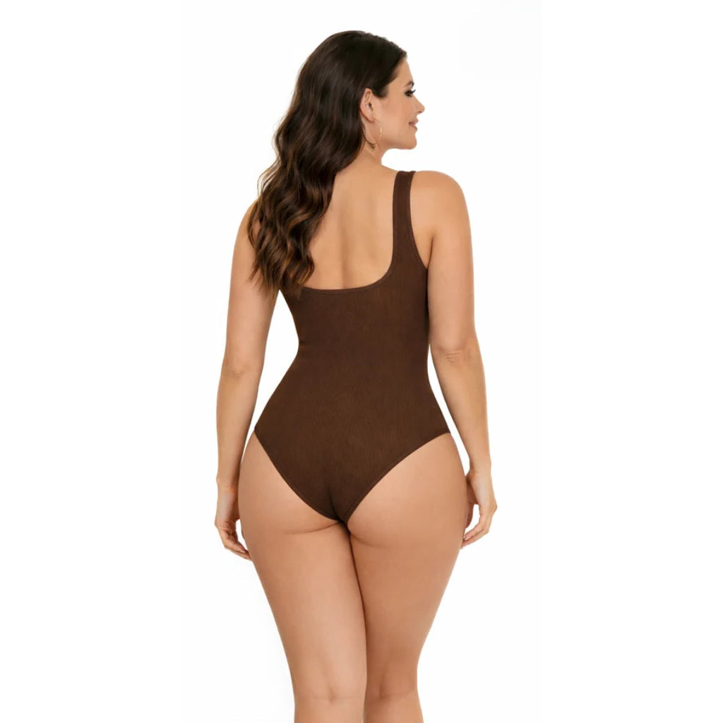 Woman wearing a brown swimsuit on a white background