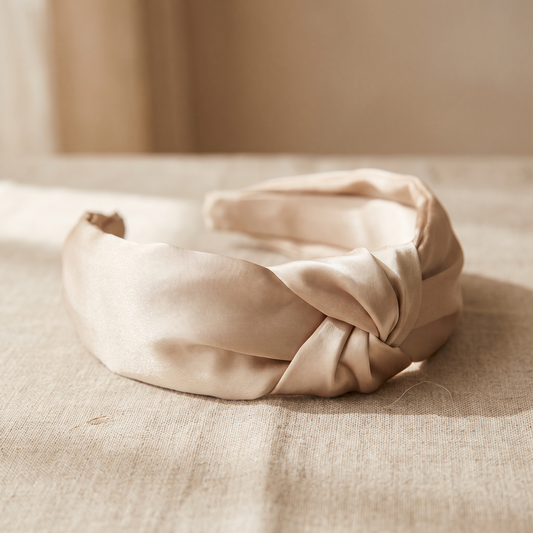 Wide champagne mulberry silk headband with soft knot on linen